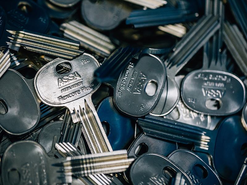 Hands holding lock cylinders